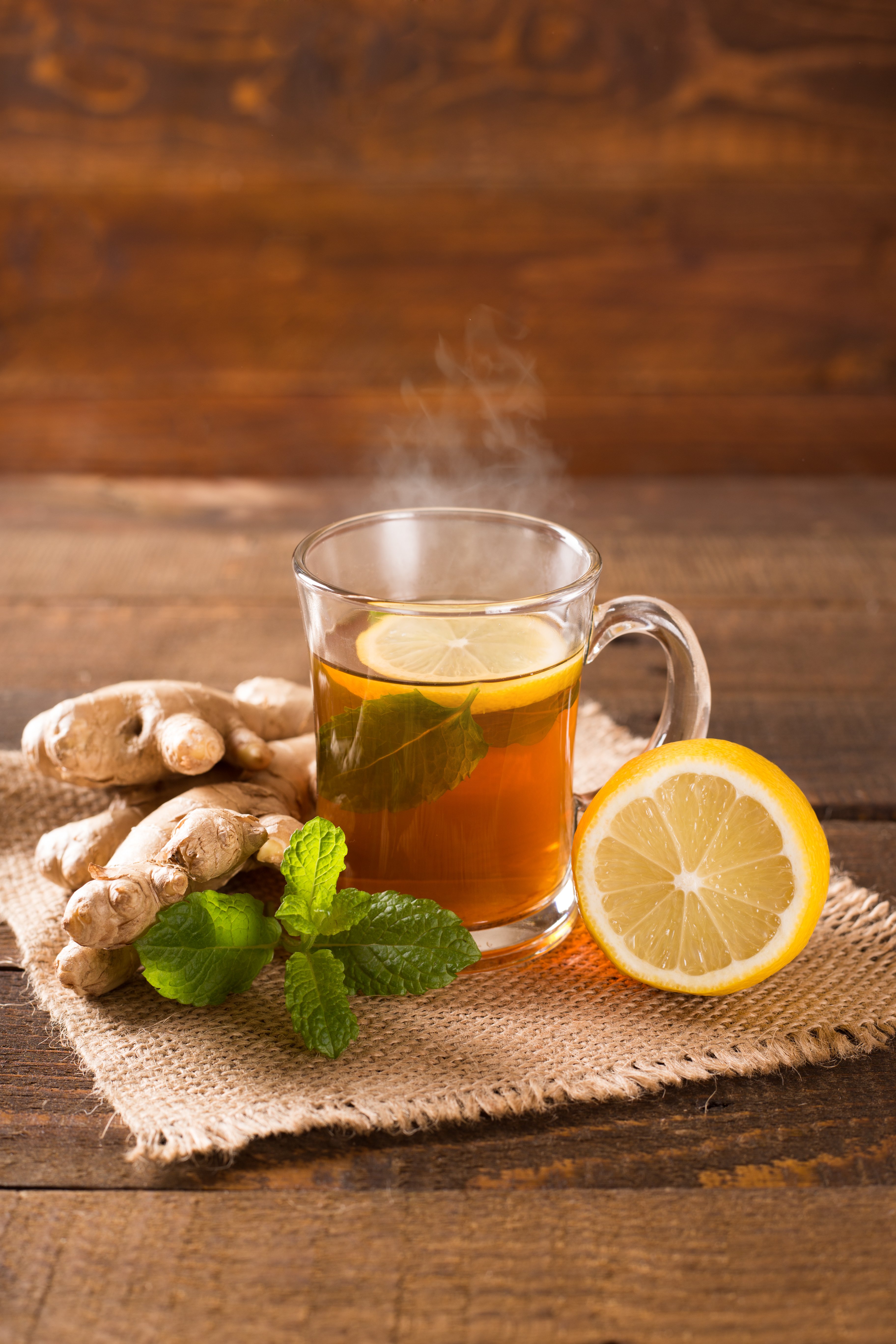 Homemade weight loss cup of hot ginger tea with mint and lemon